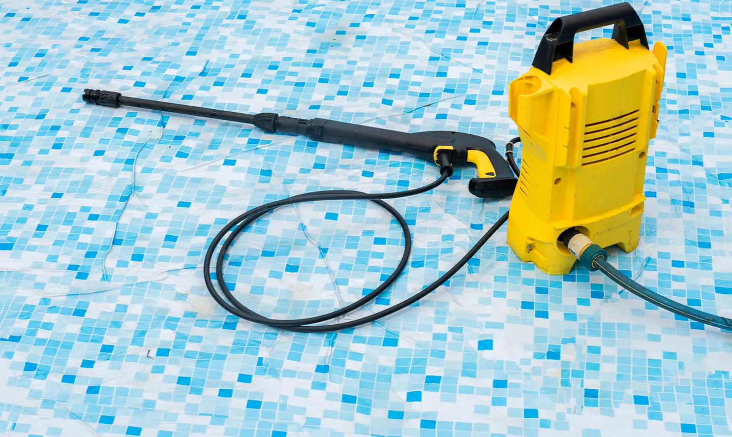 Professional tile cleaning equipment on tiled surface