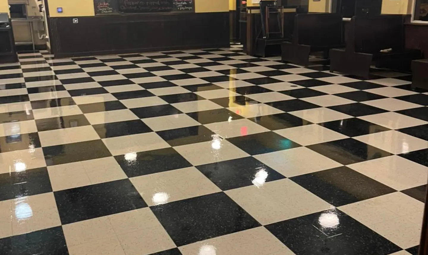 High-gloss checkered VCT floor after strip and wax